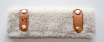 Soft-shell fluffy Lambswool pads in brown, white, and blue paired with detachable designer leather collars for dogs, made from fluffy Lambswool.