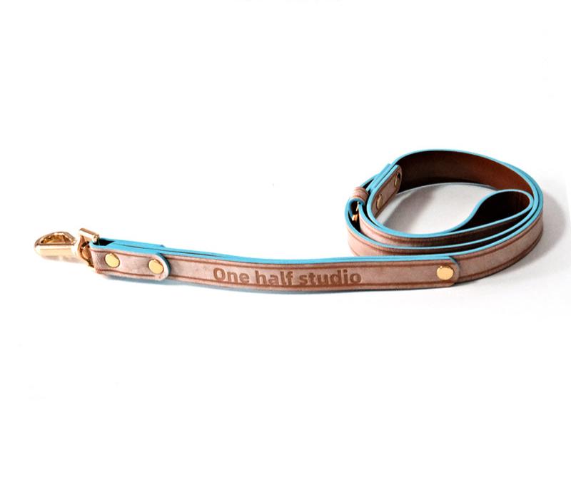 Norweigan blue leather collar with a bow design, featuring Italian handmade craftsmanship. Perfect as a personalized dog collar, designer dog collars, puppy collars, cool dog collars, cute dog collars, leather collar, and cat collar for stylish pets.