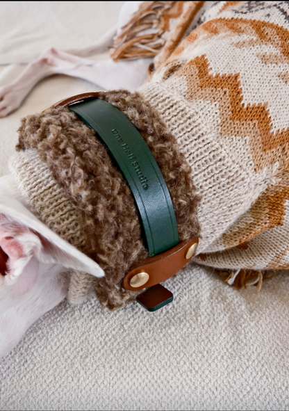 Stack of handmade Merino wool leather dog collars, featuring cozy and stylish designs in neutral and pastel tones.