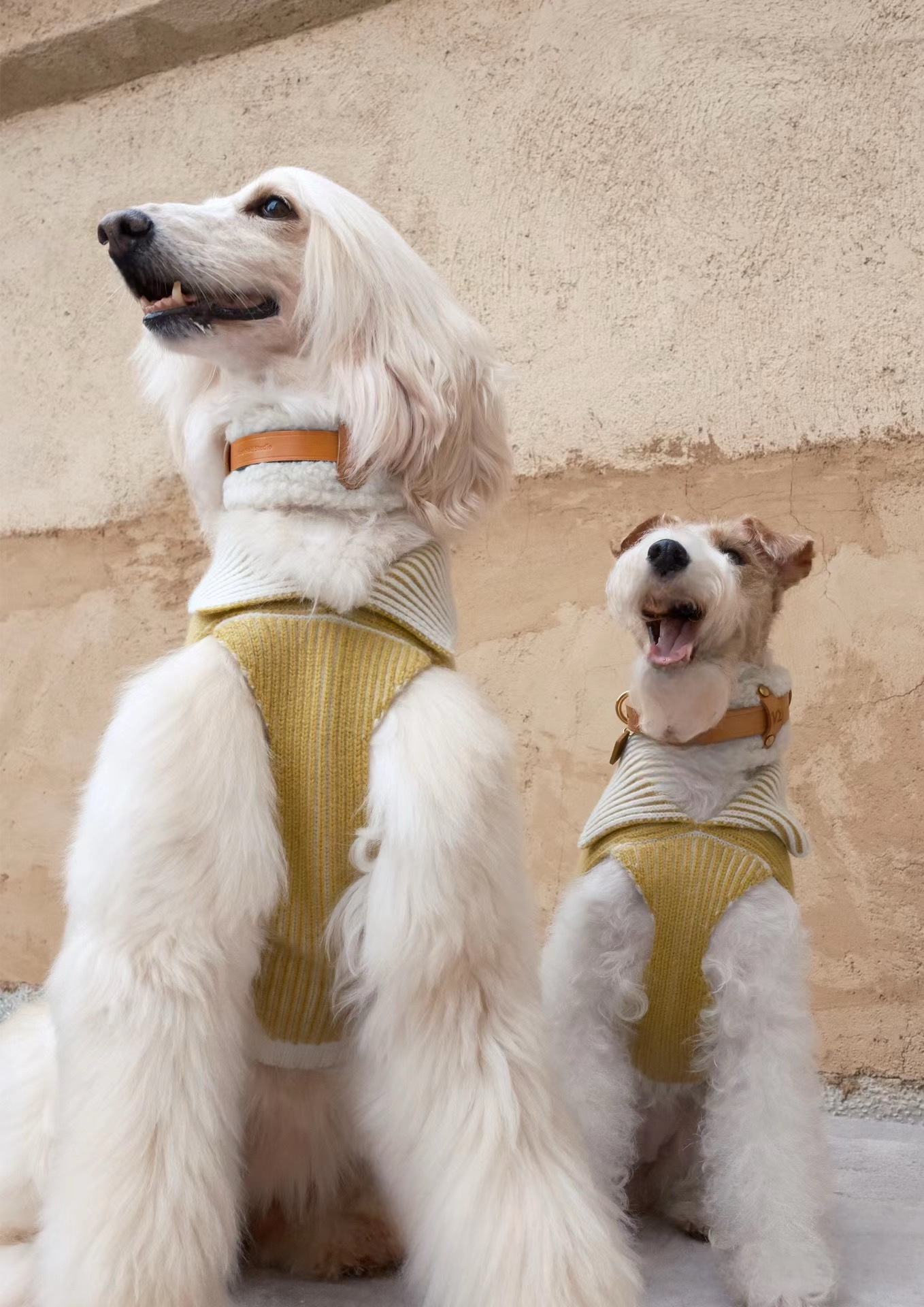 Stack of handmade Merino wool leather dog collars, featuring cozy and stylish designs in neutral and pastel tones.